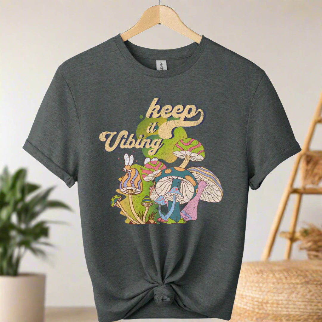 T-shirt color dark heather ,unisex with front design mushroom graphics and keep vibing typography ,retro tees