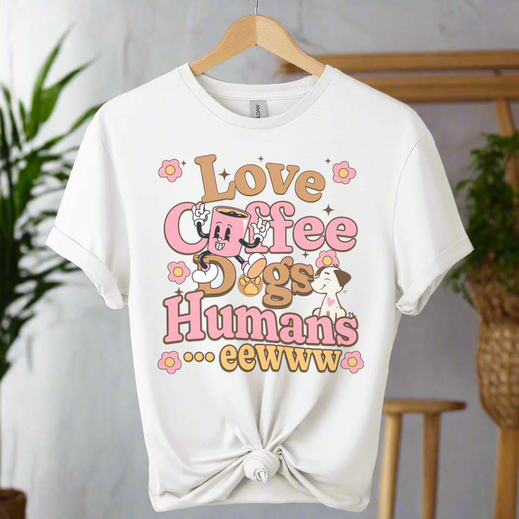 White t-shirt with colorful text and graphics love coffee and dogs on a boho background