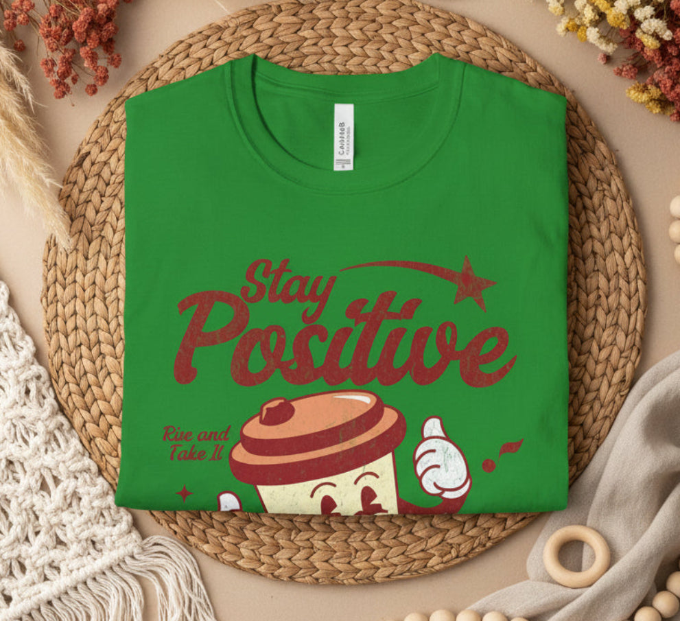 Irish Green t-shirt with 'Stay Positive' and a cup design on a white background