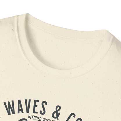 Close-up of a beige t-shirt with 'WAVES & CO' text on a white background
