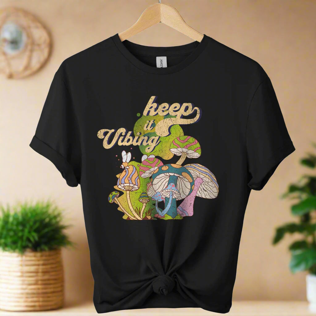 T-shirt color Black,unisex with front design mushroom graphics and keep vibing typography ,retro tees 