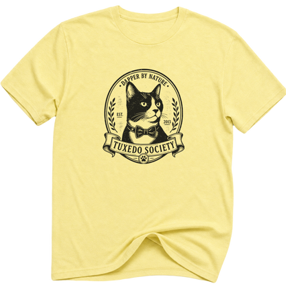 A cornsilk  folded-sleeve crewneck t-shirt featuring a black graphic print of a cat wearing a bow tie inside an oval emblem with the text 'TUXEDO SOCIETY' and 'CAPER BY NATURE'.