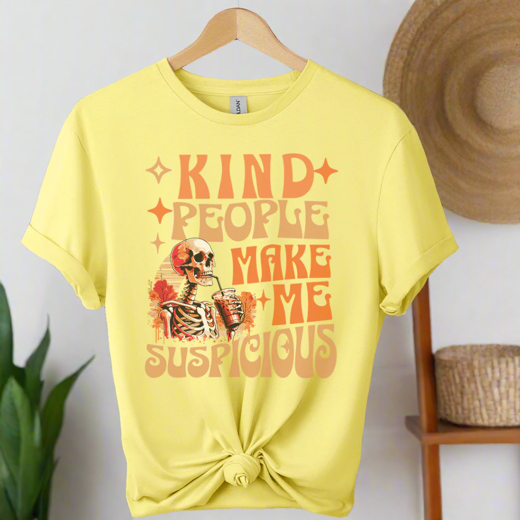 Cornsilk t-shirt with a skeleton graphic and text on a hanger