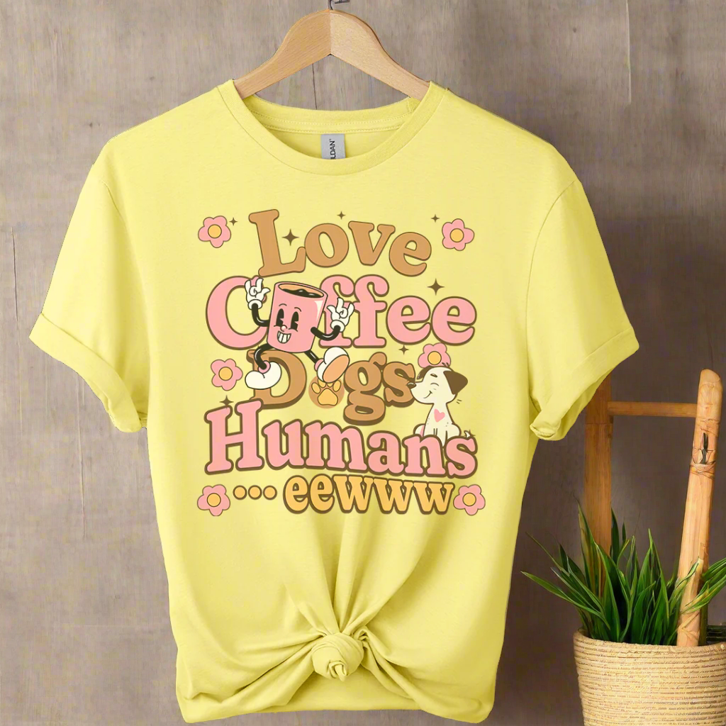 Yellow t-shirt with graphic design and colorful text on a boho background