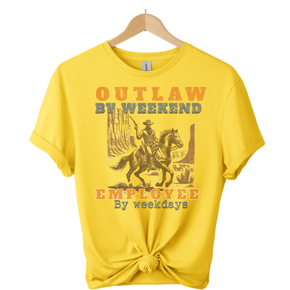 Yellow t-shirt with a graphic of a person on a horse and text, hanging on a wooden hanger.