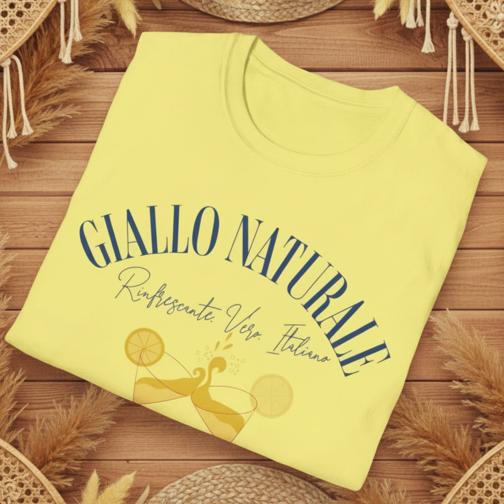 Folded  t-shirt with 'GIALLO NATURALE' text and lemon graphics on a white background