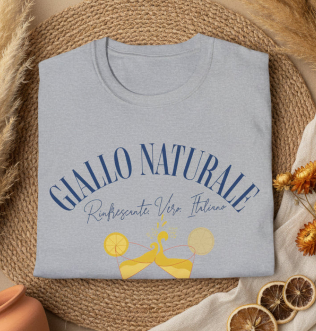 Folded gray t-shirt with 'GIALLO NATURALE' text and graphics on a boho background