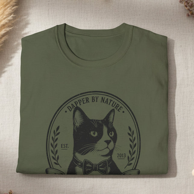 Folded military green t-shirt with a campfire design on a white background