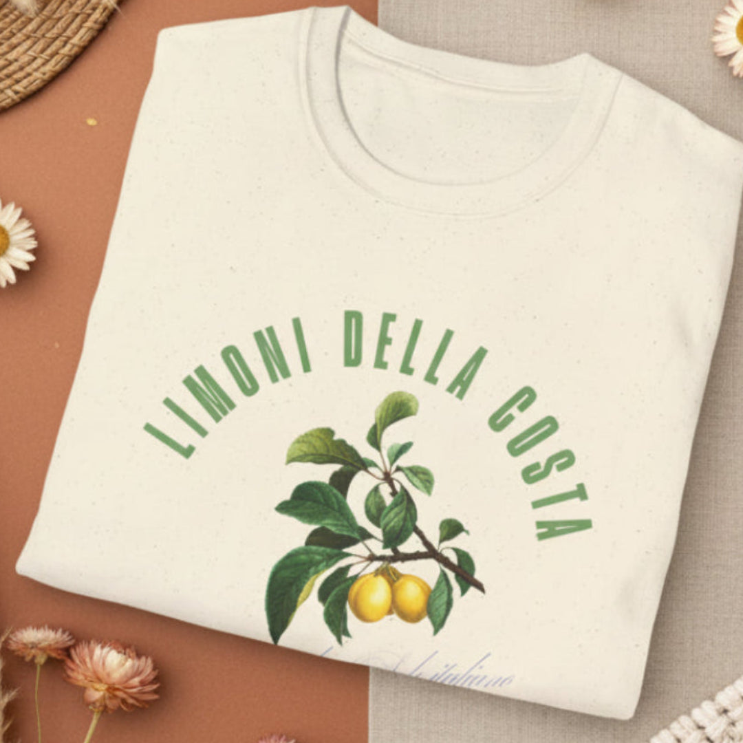 Sand color  foldedt-shirt with a vintage Italian botanical lemon branch graphic and green Limoni Della Costa Italia text