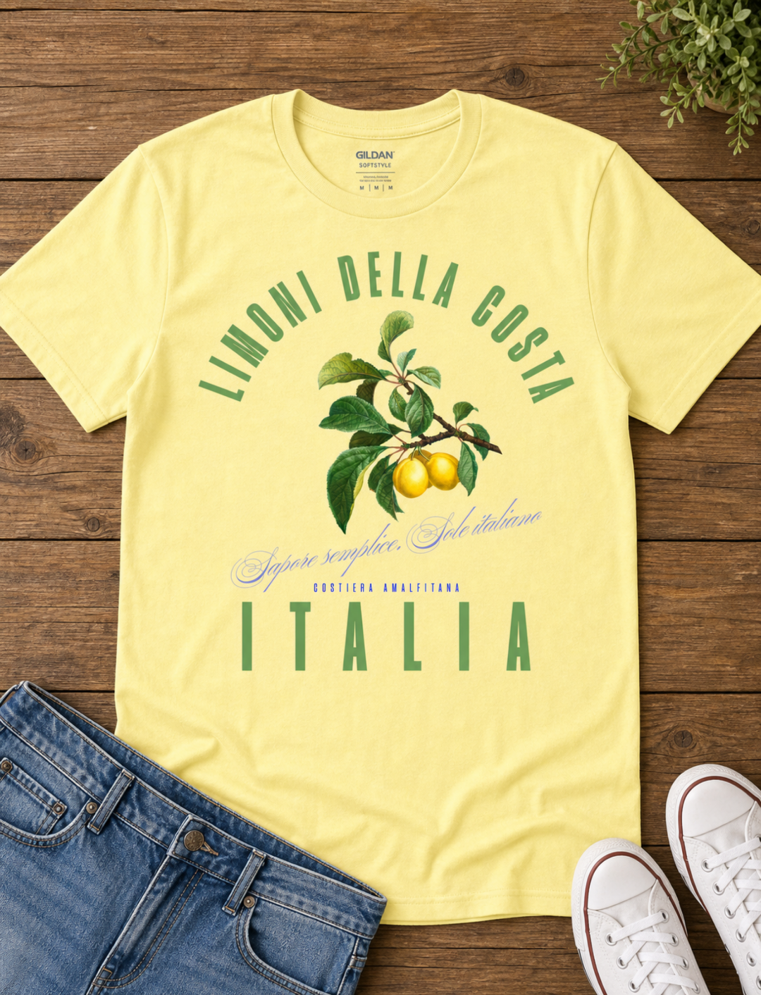 corn silk t-shirt with a vintage Italian botanical lemon branch graphic and green Limoni Della Costa Italia text