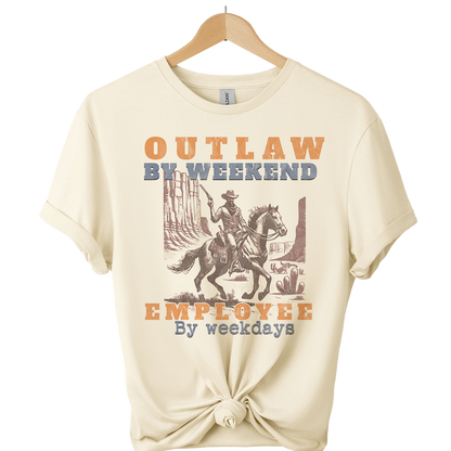 Beige t-shirt with a graphic of a cowboy on a horse and text 'Outlaw by weekend, Employee by weekdays' on a white background.