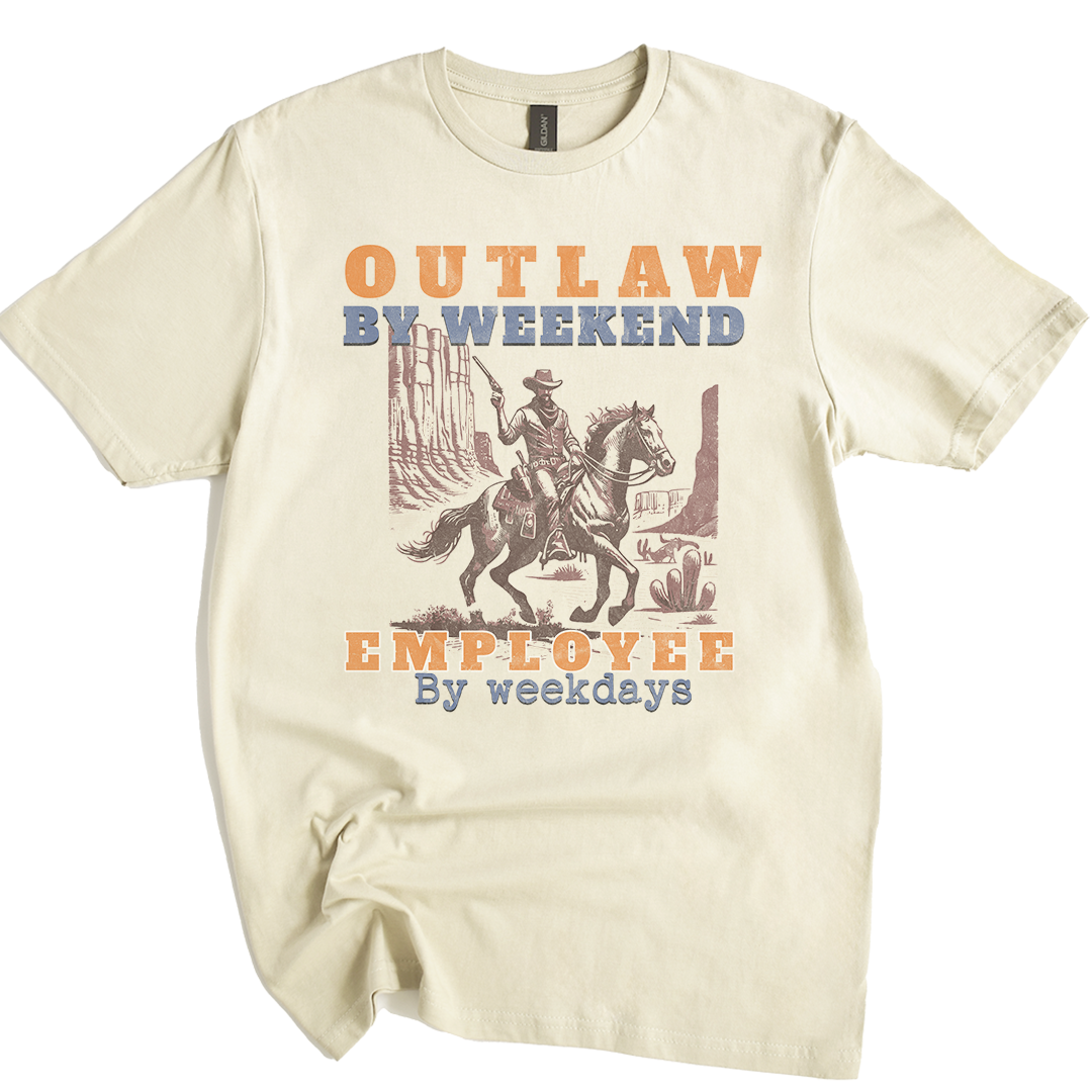 Beige t-shirt with a graphic of a cowboy on a horse and text 'Outlaw by weekend, Employee by weekdays' on a white background.