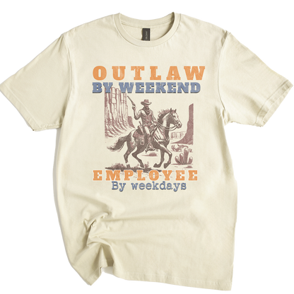 Beige t-shirt with a graphic of a cowboy on a horse and text 'Outlaw by weekend, Employee by weekdays' on a white background.
