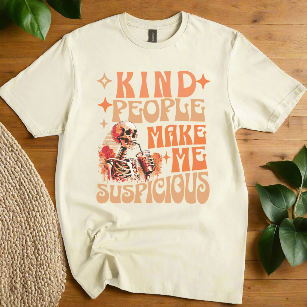 Natural t-shirt with skeleton graphic and text 'Kind people make me suspicious' on a white background