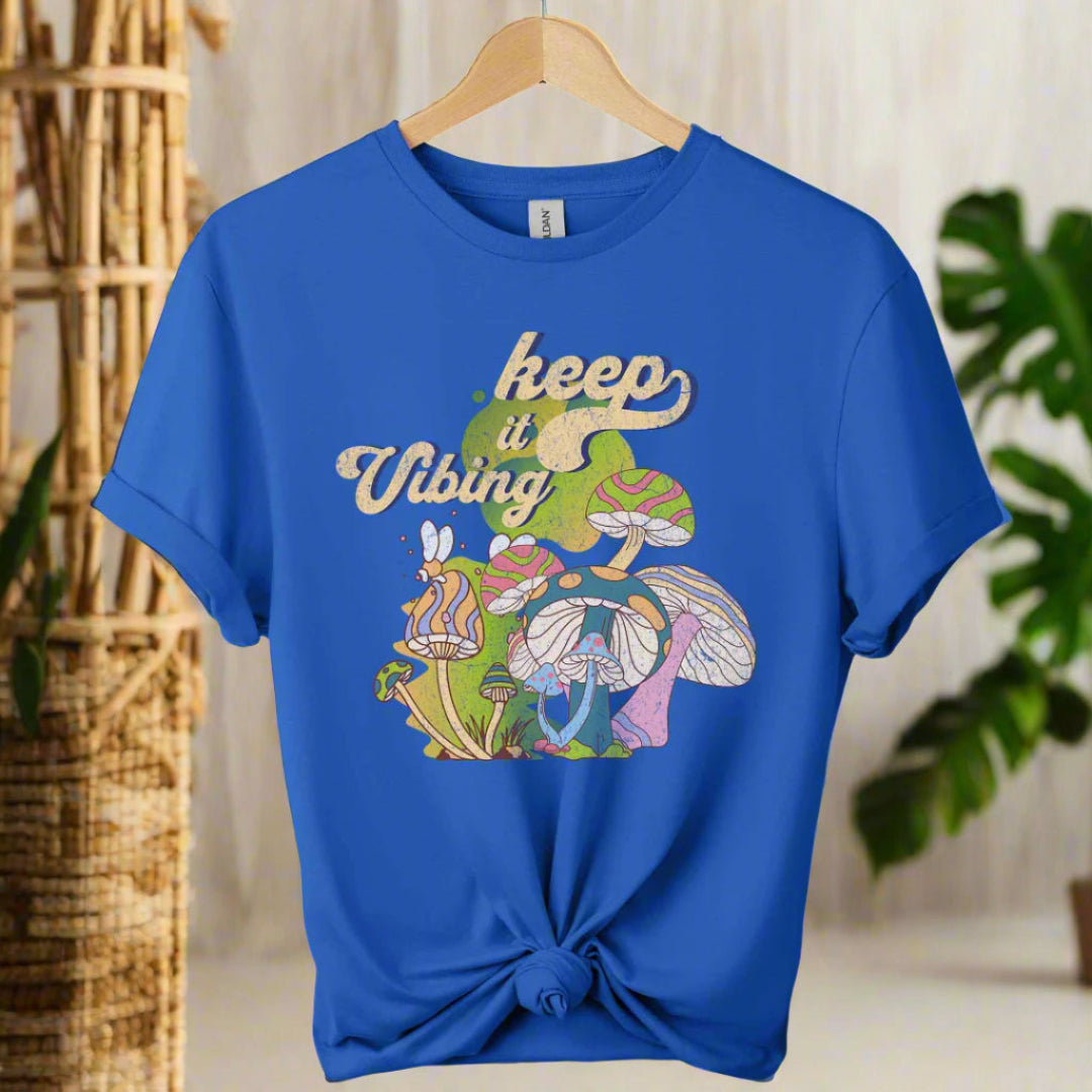 T-shirt color royal blue ,unisex with front design mushroom graphics and keep vibing typography ,retro tees 