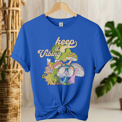 T-shirt color royal blue ,unisex with front design mushroom graphics and keep vibing typography ,retro tees 