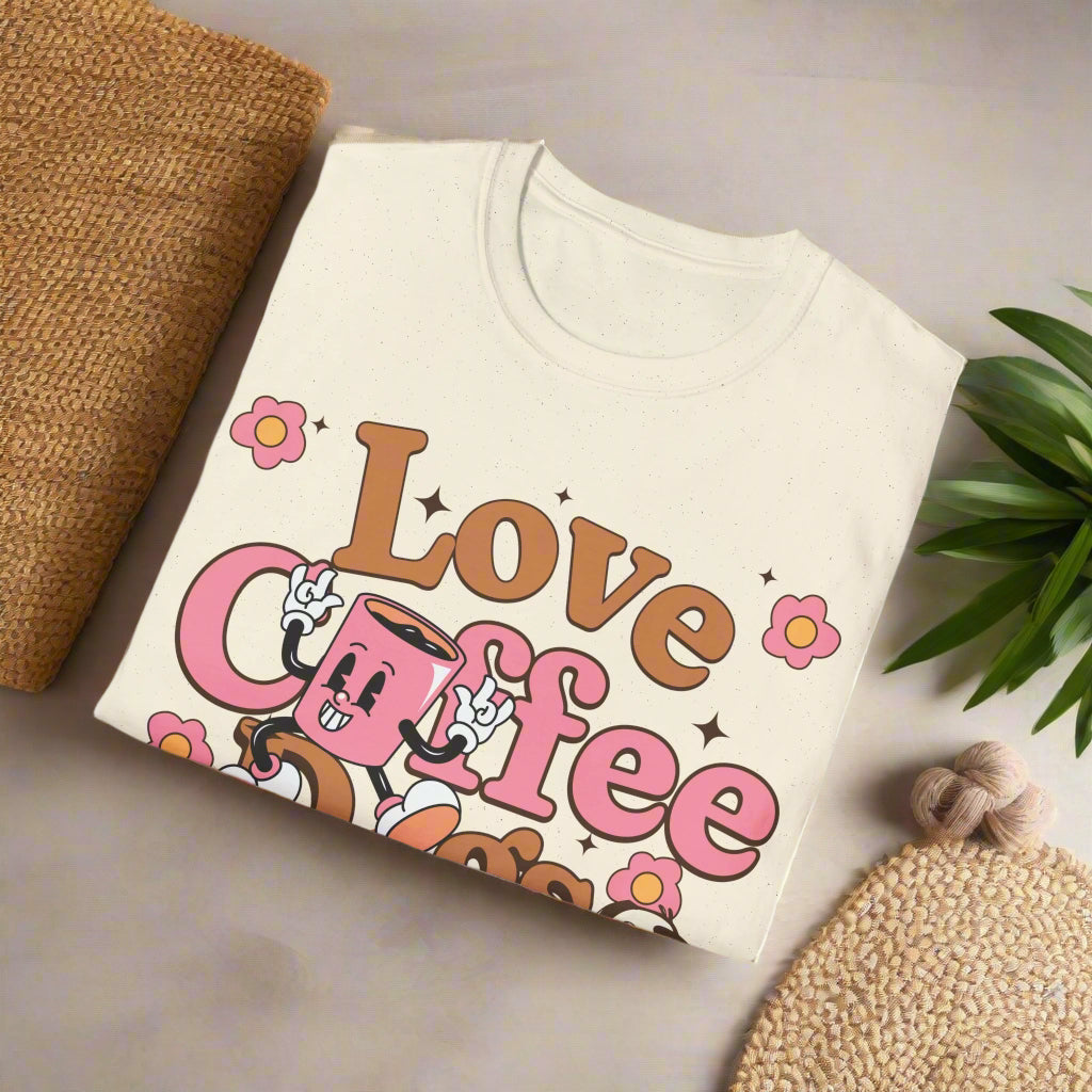 Sand color Folded t-shirt with 'Love Coffee' graphic design on a white background