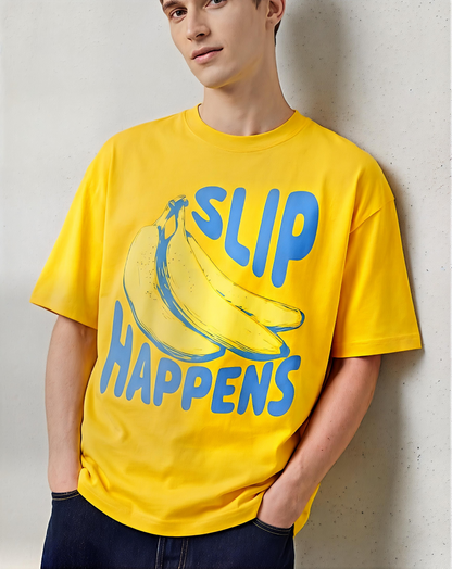 Person wearing a cornsilk t-shirt with 'SLIP HAPPENS' and banana graphic.