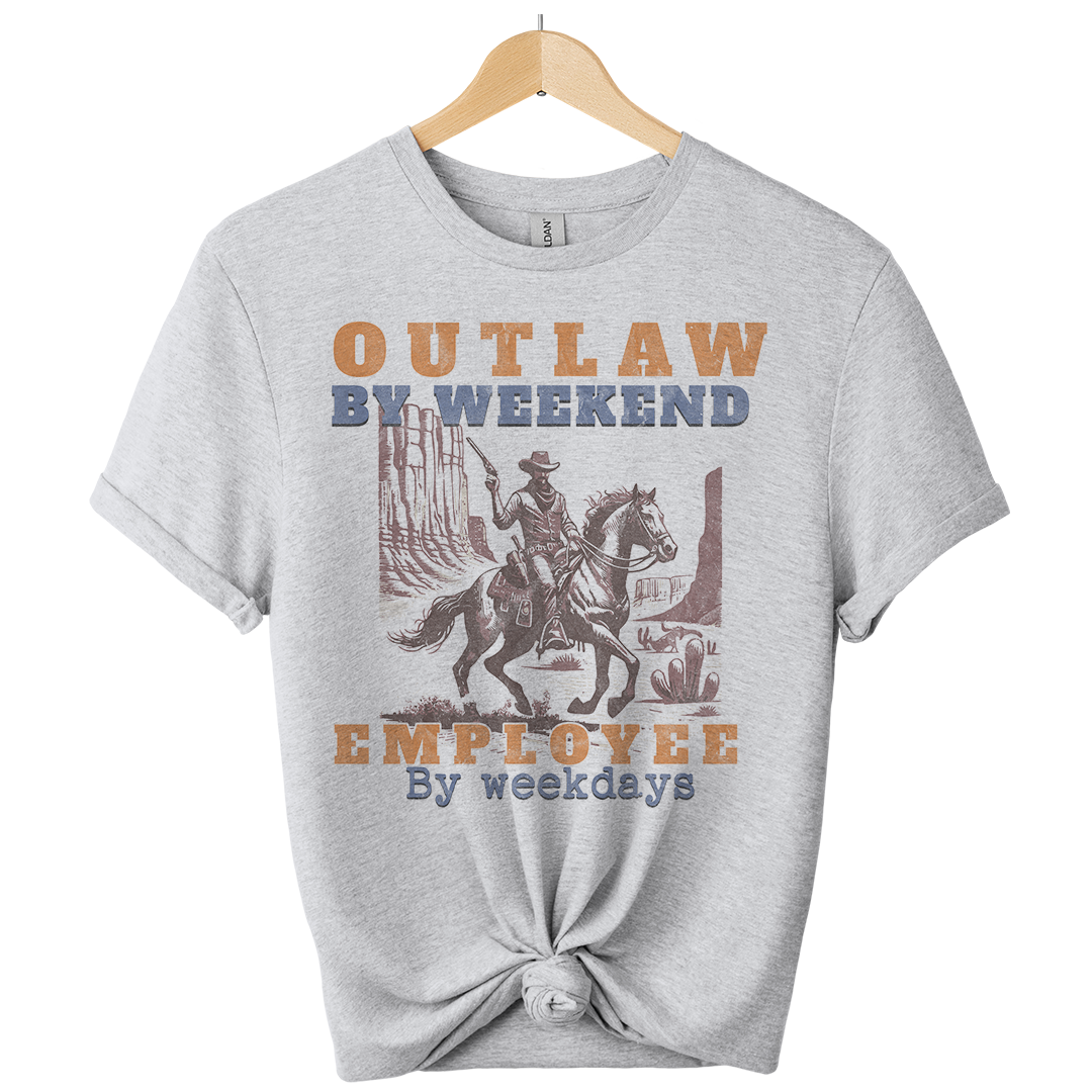 Gray t-shirt with a graphic of a cowboy on a horse and text 'Outlaw by weekend, Employee by weekdays' on a white background.