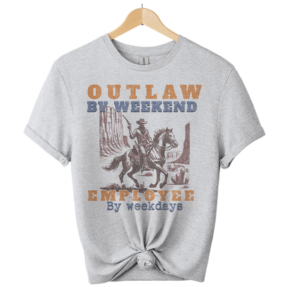 Gray t-shirt with a graphic of a cowboy on a horse and text 'Outlaw by weekend, Employee by weekdays' on a white background.