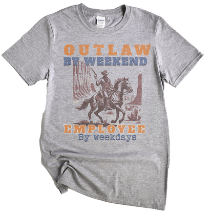 Gray t-shirt with a graphic of a cowboy on a horse and text 'Outlaw by Weekend, Employee by Weekdays' on a white background.