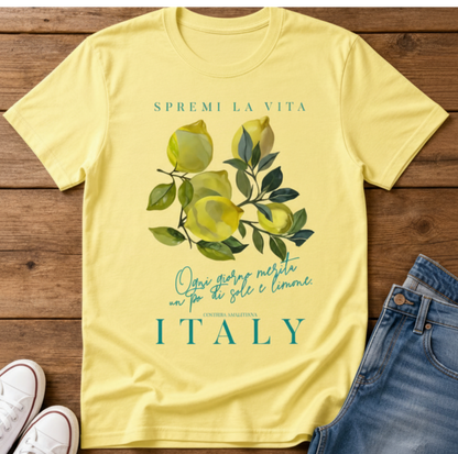 cornsilk flatlay t-shirt with a watercolor Mediterranean lemon graphic and teal Italian text reading Spremi La Vita Italy