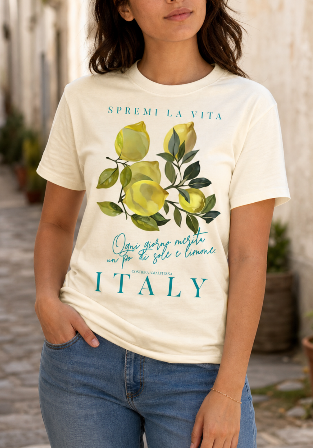women model natural color  t-shirt with a watercolor Mediterranean lemon graphic and teal Italian text reading Spremi La Vita Italy