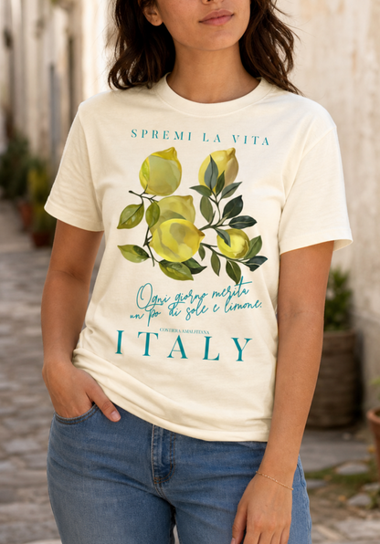 women model natural color  t-shirt with a watercolor Mediterranean lemon graphic and teal Italian text reading Spremi La Vita Italy