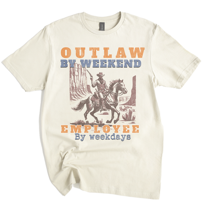Beige t-shirt with a graphic of a cowboy on a horse and text 'Outlaw by weekend, Employee by weekdays' on a white background.