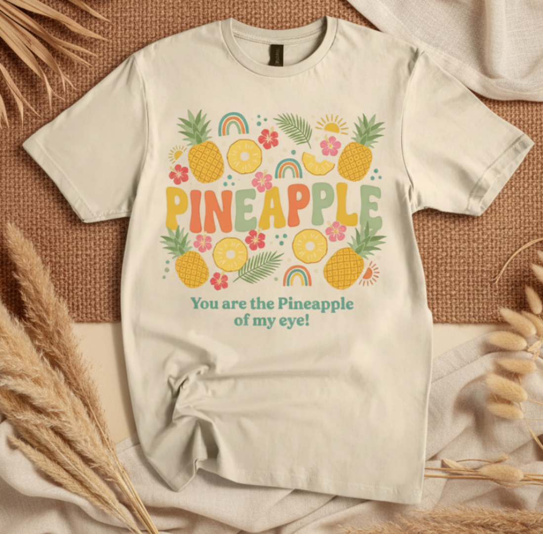 sand t-shirt with pineapple design and text on a boho background