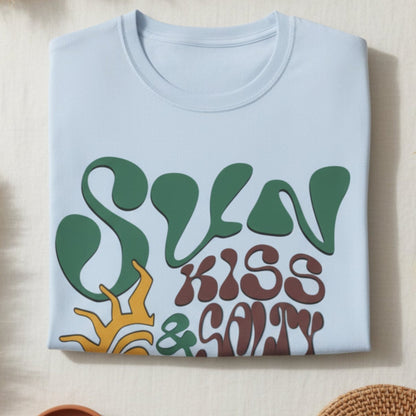 folded Light blue t-shirt with csun kiss salty  design on a white background