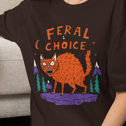 A woman wearing a softstyle ringspun cotton tshirt color darkchocolate round neck a cat graphic tshirt ferral by choice . Neilikha