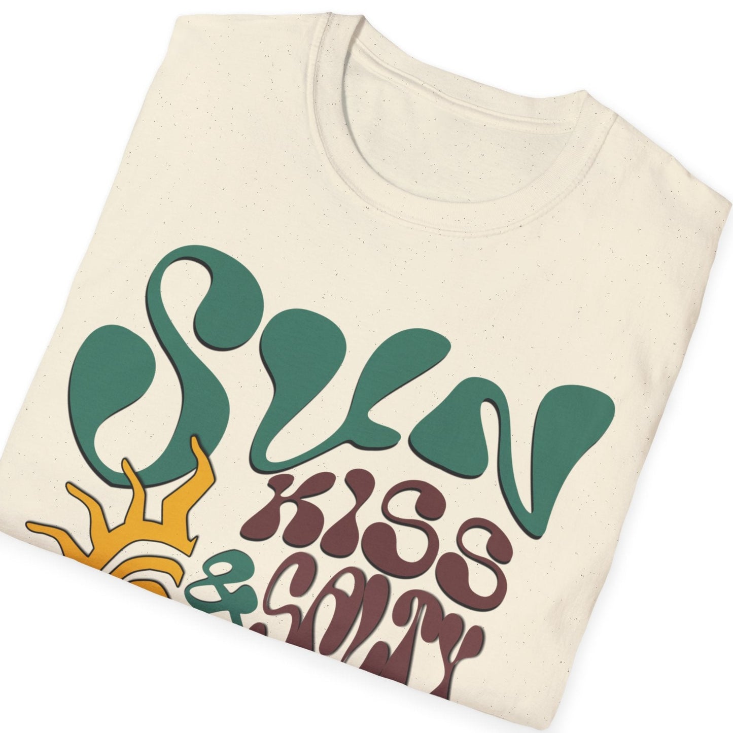 Natural folded t-shirt featuring a wavy 70s groovy font graphic reading Sun Kissed and Salty Like My Attitude with a sun drawing