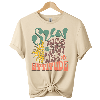 Sand t-shirt featuring a wavy 70s groovy font graphic reading Sun Kissed and Salty Like My Attitude with a sun drawing