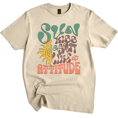 Sand t-shirt featuring a wavy 70s groovy font graphic reading Sun Kissed and Salty Like My Attitude with a sun drawing