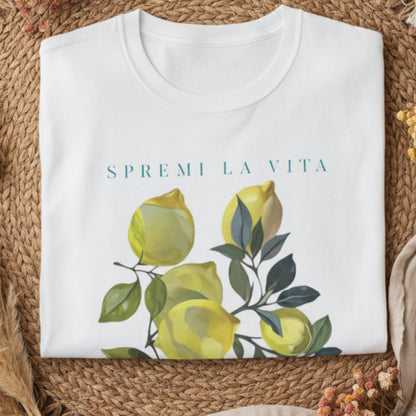 white folded t-shirt with a watercolor Mediterranean lemon graphic and teal Italian text reading Spremi La Vita Italy