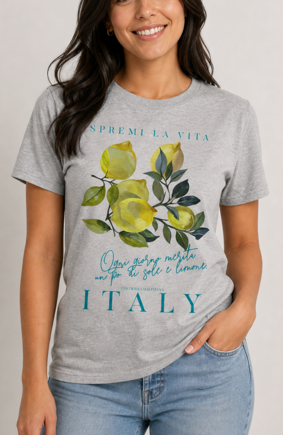 women wearing t-shirt with a watercolor Mediterranean lemon graphic and teal Italian text reading Spremi La Vita Italy